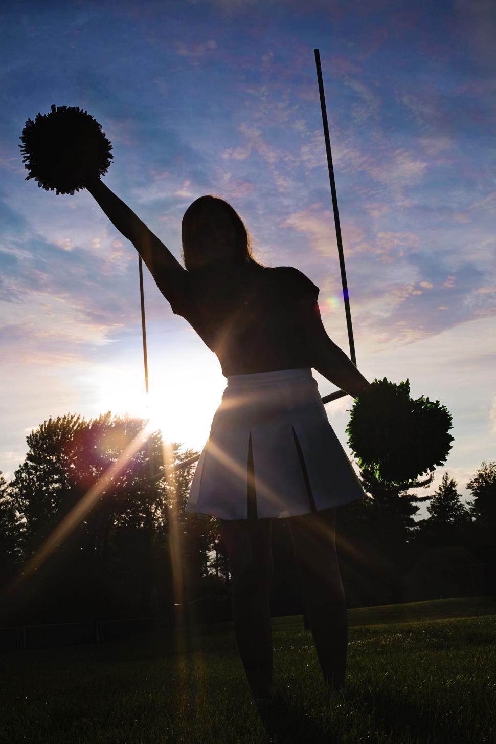 Free Image of Cheerleader girl and sunset 