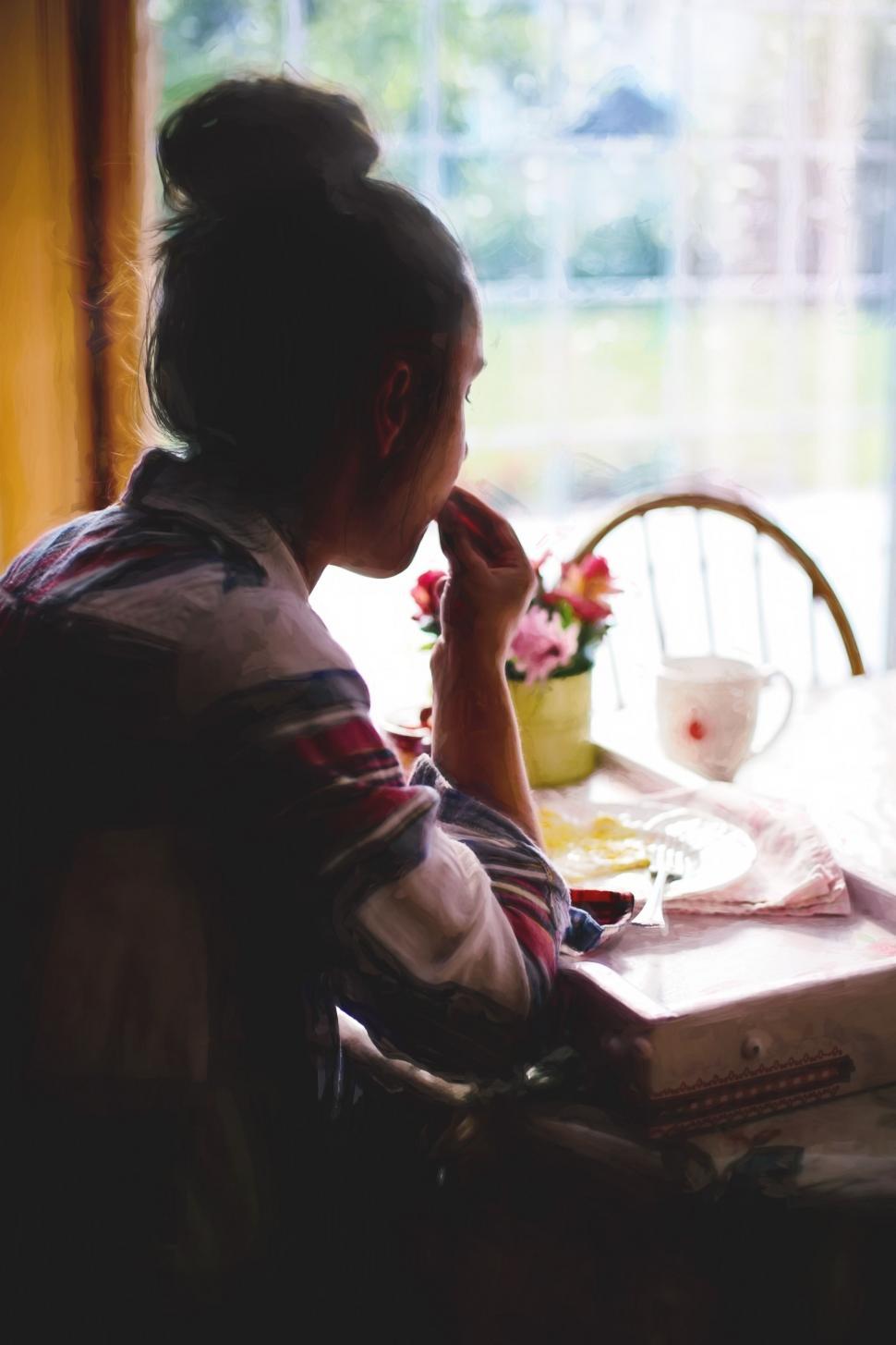 Free Image of Young Girl at breakfast table 