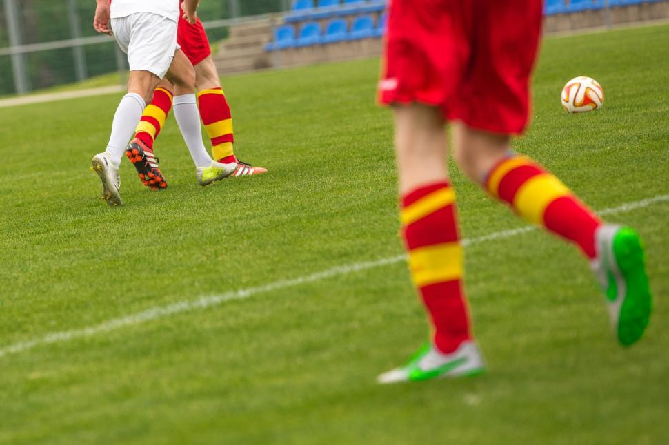 Free Image of Football players feet with ball on ground 
