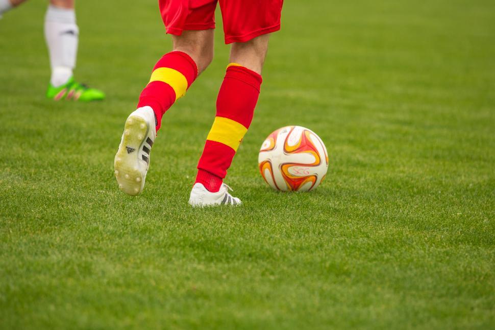 Free Image of Football player running with a ball 