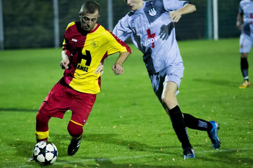 Free Image of Soccer players fighting for ball during a match 