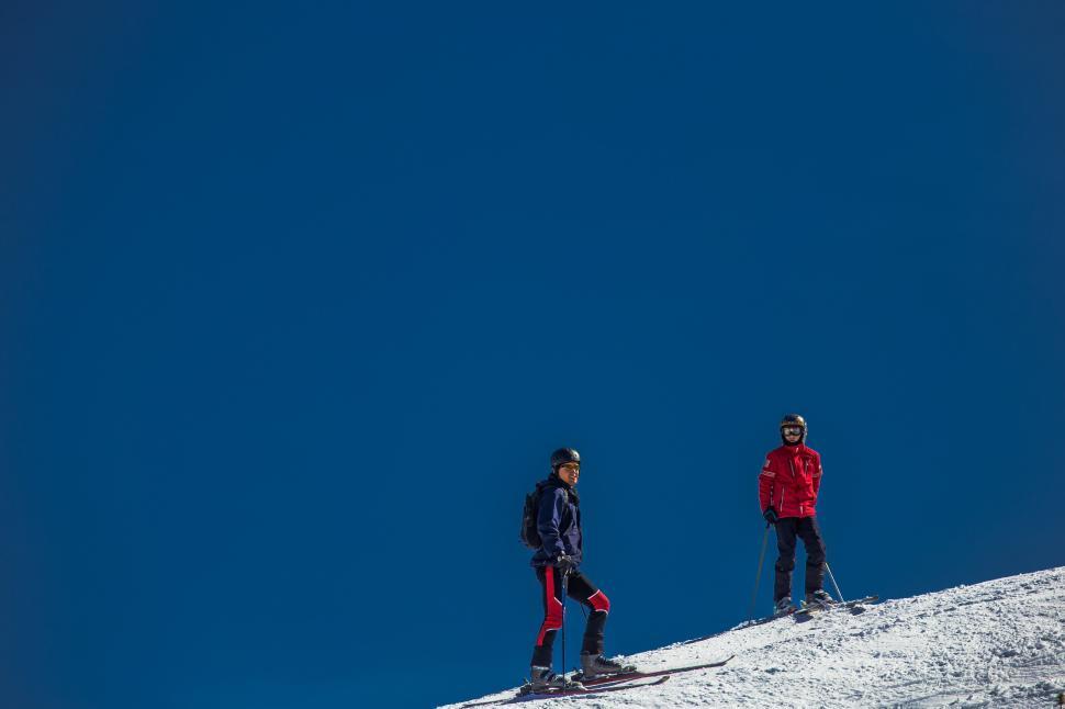 Free Image of Two Skiers on ski runway 