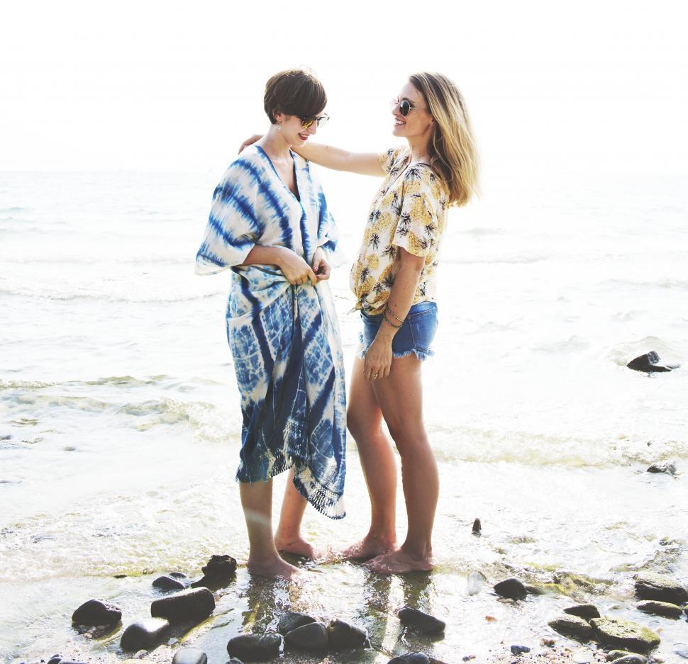 Free Image of Two Caucasian women standing at a beach 