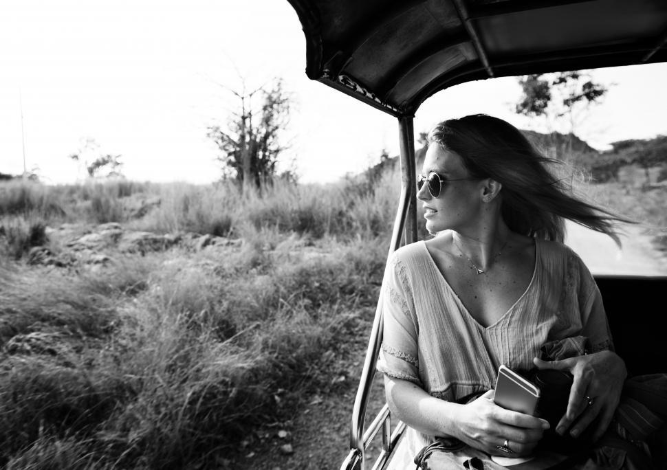 Free Image of A young woman enjoying ride in the forest, black and white 