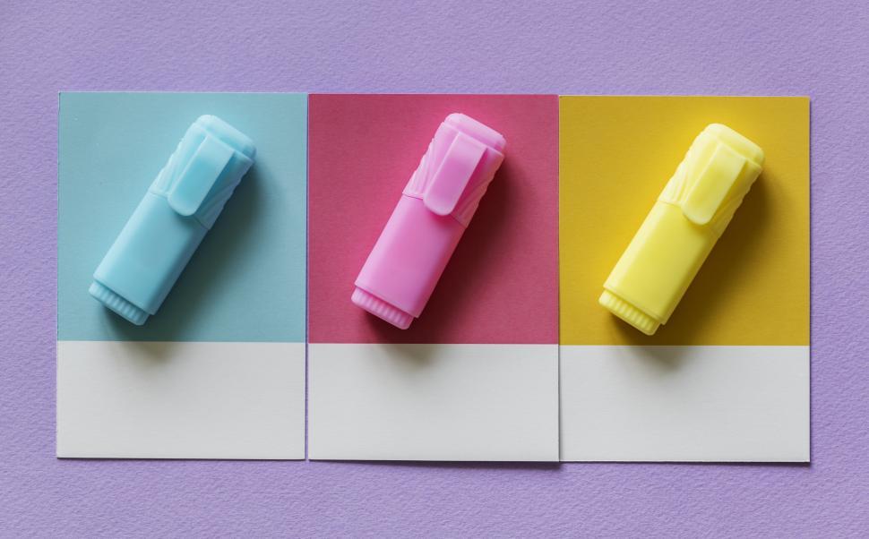 Free Image of Flat lay of three highlighters on three spaced cardboard frames 