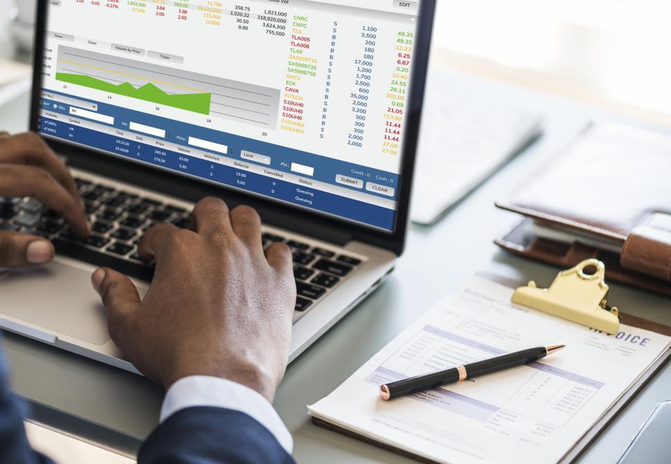 Free Image of Close up of a person doing work at a desk 