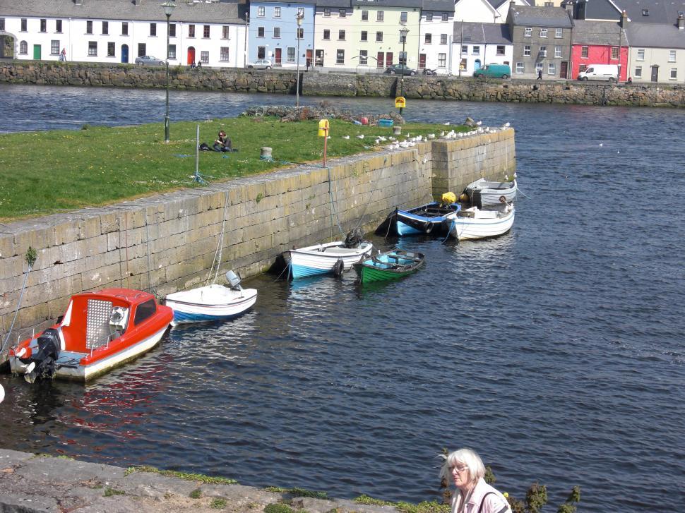 Free Image of Group of Boats Along Riverbank 