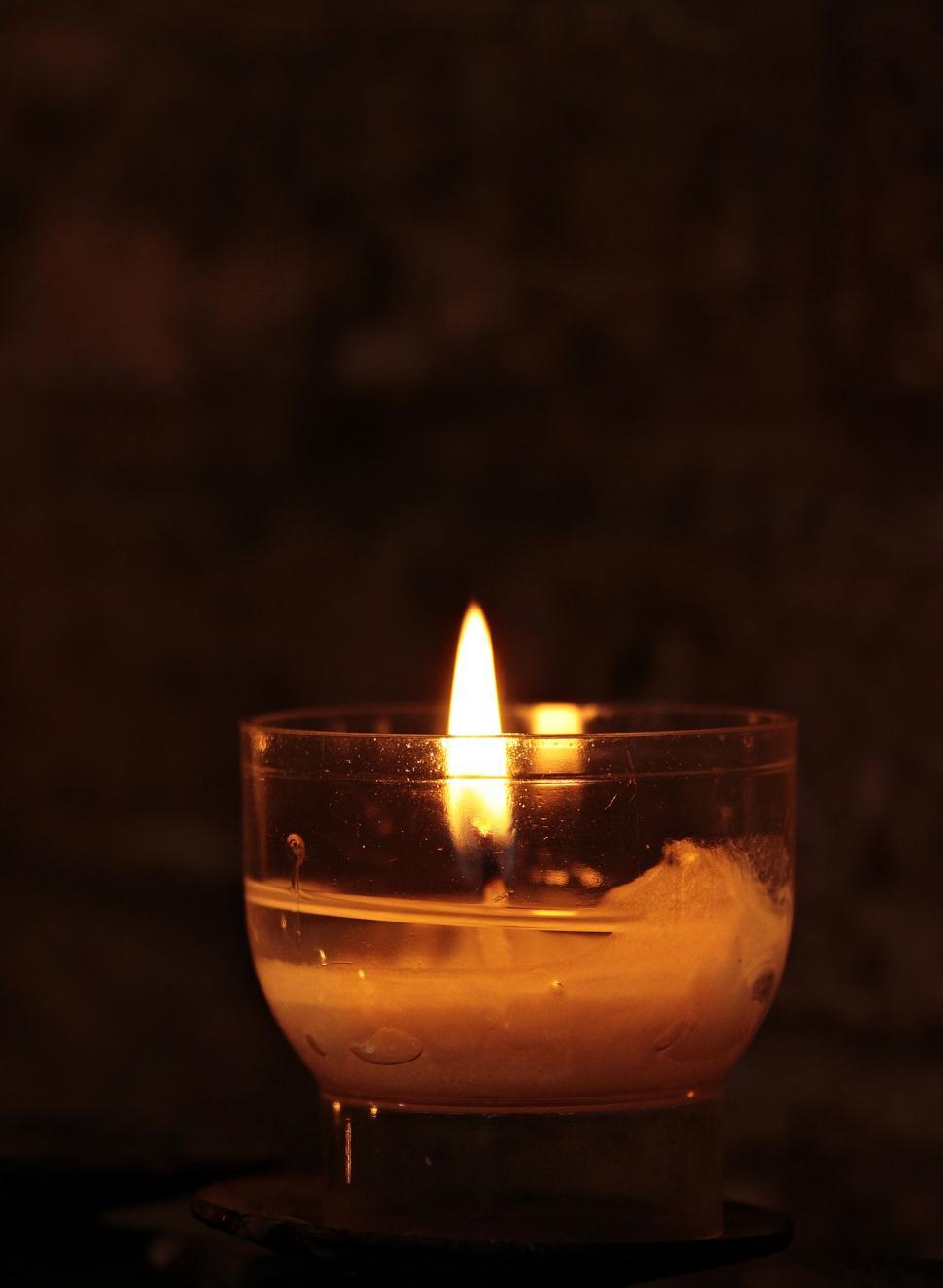Free Image of Lit Tea light on black background 