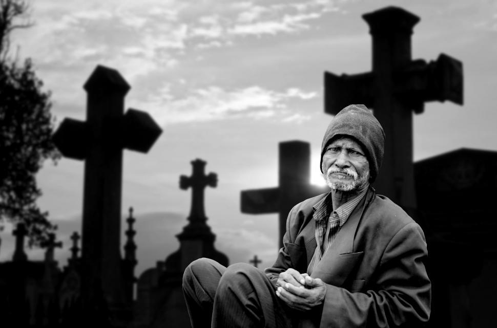 Free Image of Lonely Man Sitting at Graveyard - B&W 