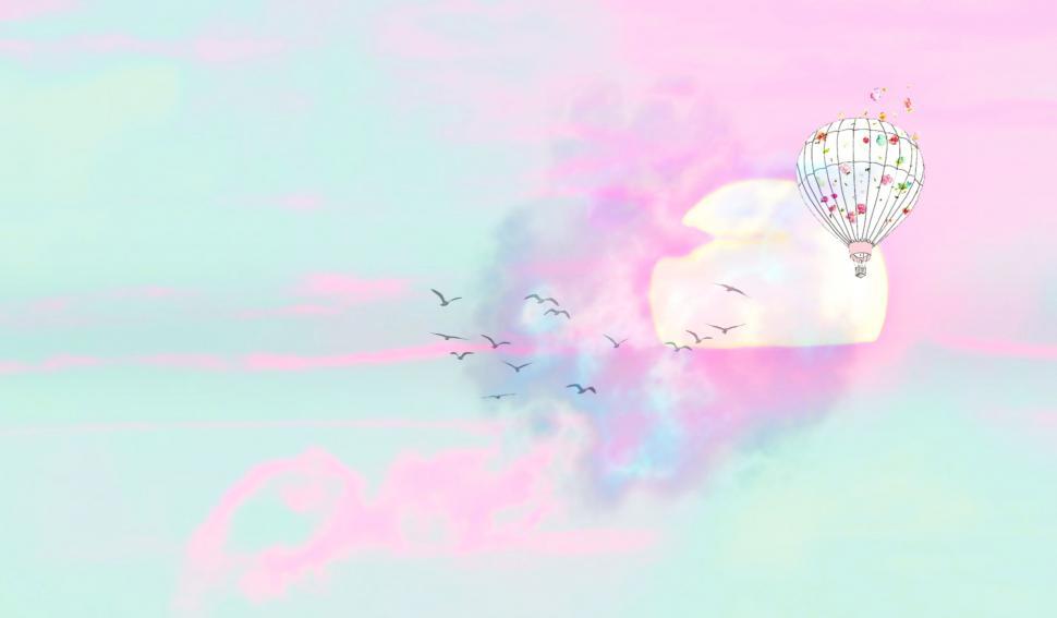 Free Image of Hot air balloon with sun and colorful clouds - Illustration 