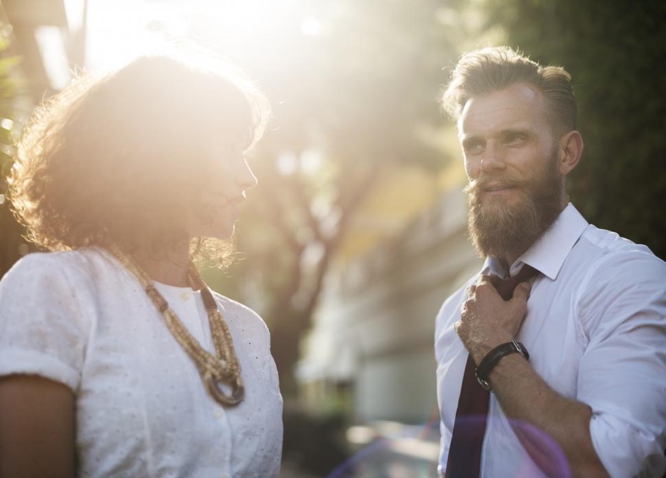 Free Image of Two business people in a discussion in the sun 
