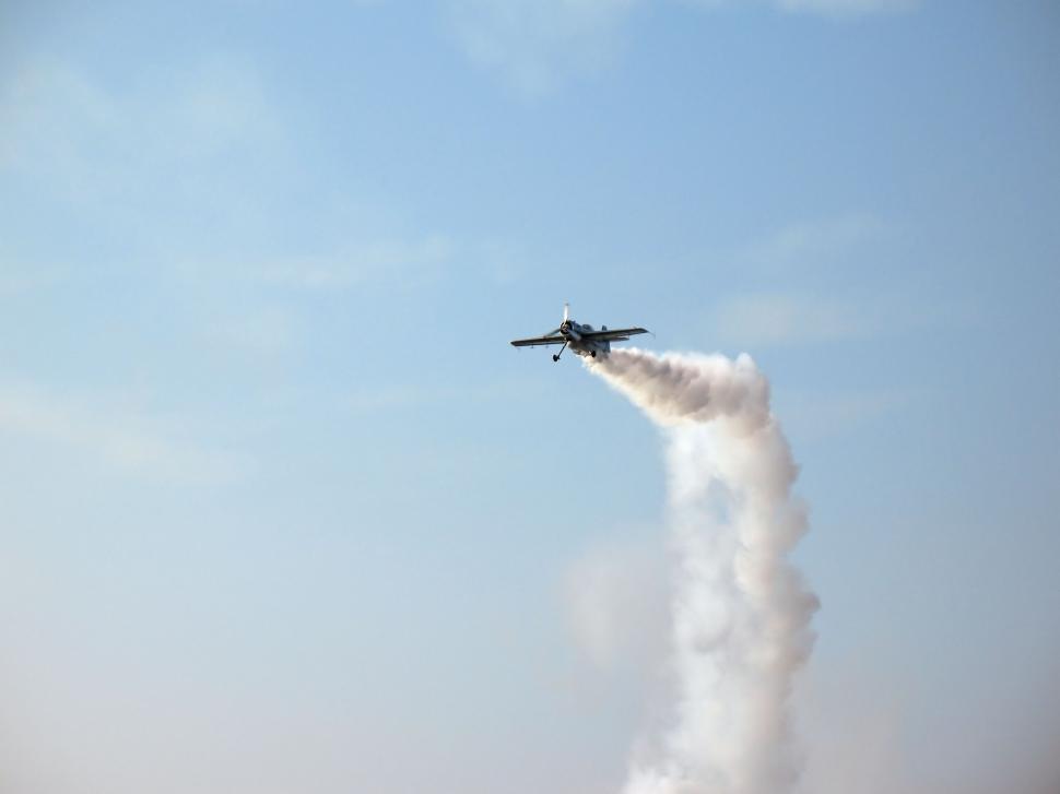 Free Image of Aerobatic plane making loopings in the air 