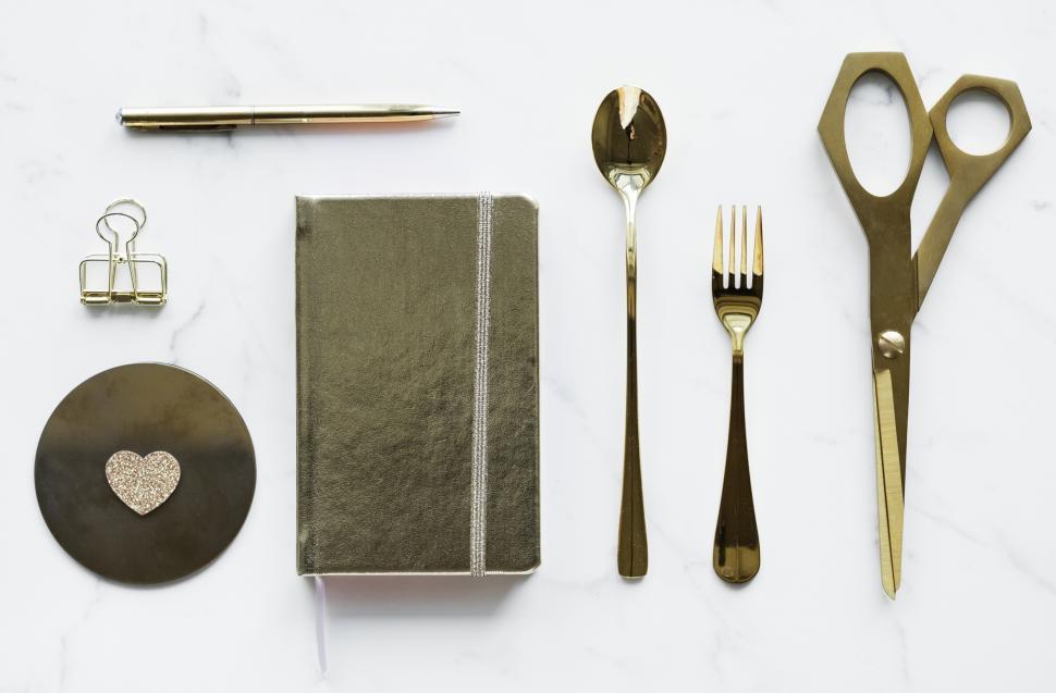 Free Image of Flat lay of a golden scissors with others stationery items 