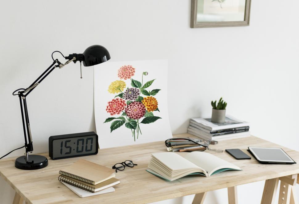 Free Image of Close up of a illustration and books on a study table 
