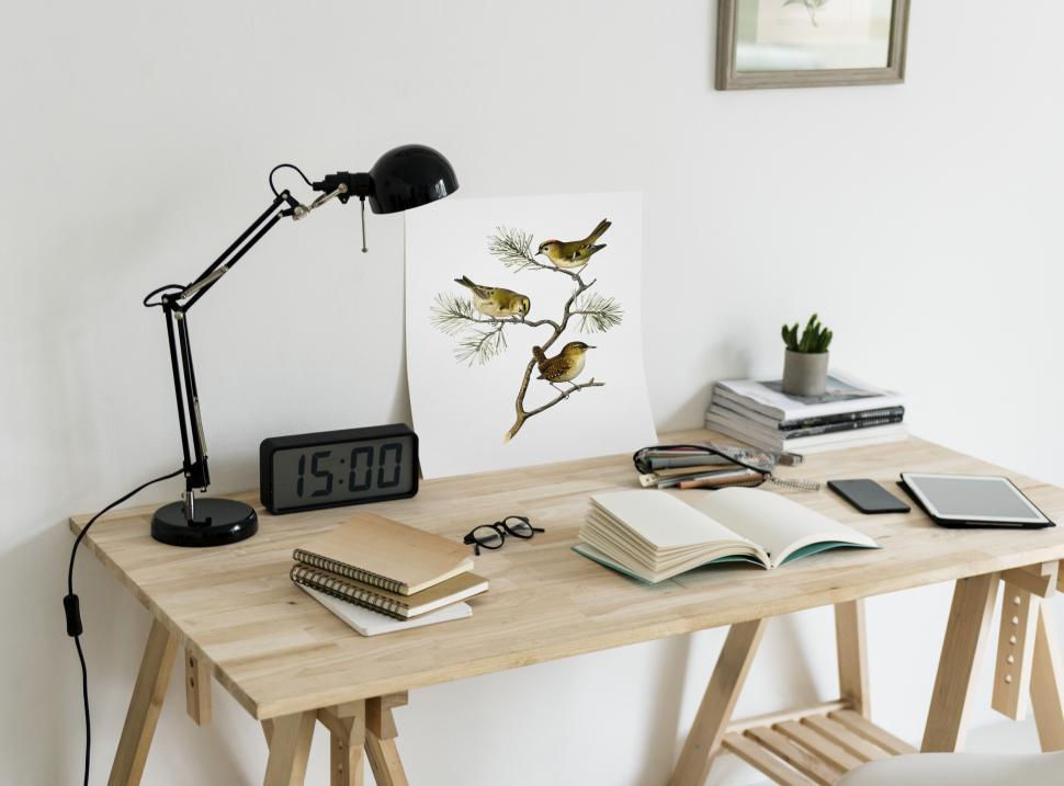 Free Image of Close up of a picture and books on a study table 
