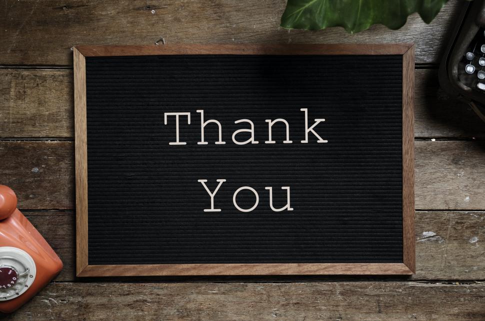 Free Image of Overhead view of text Thank You arranged on an old bulletin board 