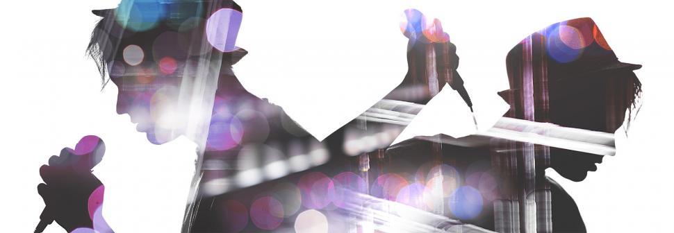 Free Image of Silhouette of two singers masking concert background 