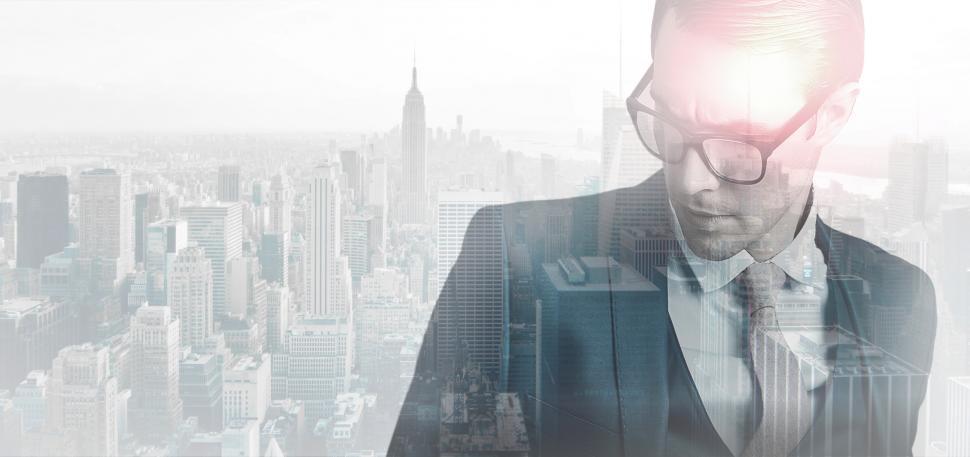 Free Image of Closeup of Young Businessman Over Cityscape - Double Exposure 