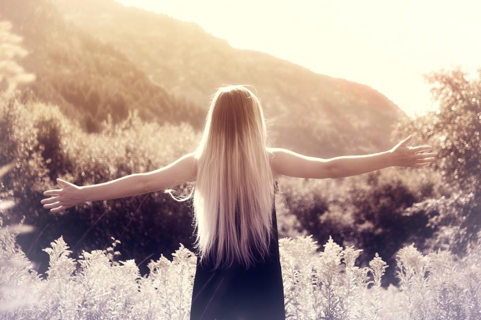 Free Image of Young Woman with Arms Wide Open 