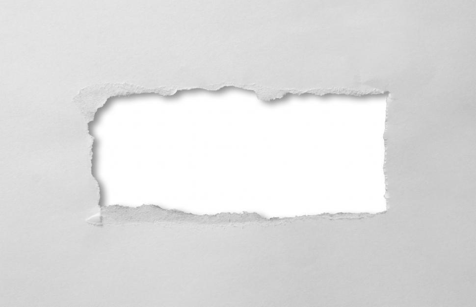 Free Image of A hole torn through paper 