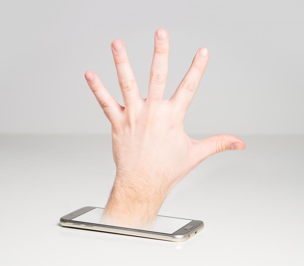 Free Image of Cyber security concept created with a hand and a mobile phone 
