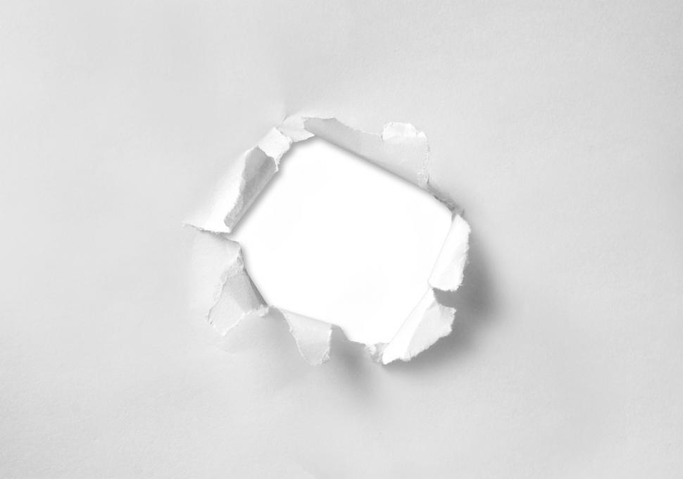 Free Image of A round hole torn through paper 