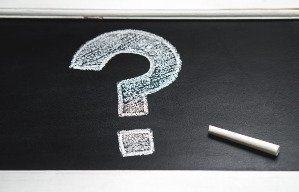 Free Image of Question mark drawn with chalk on chalkboard and stick of chalk 