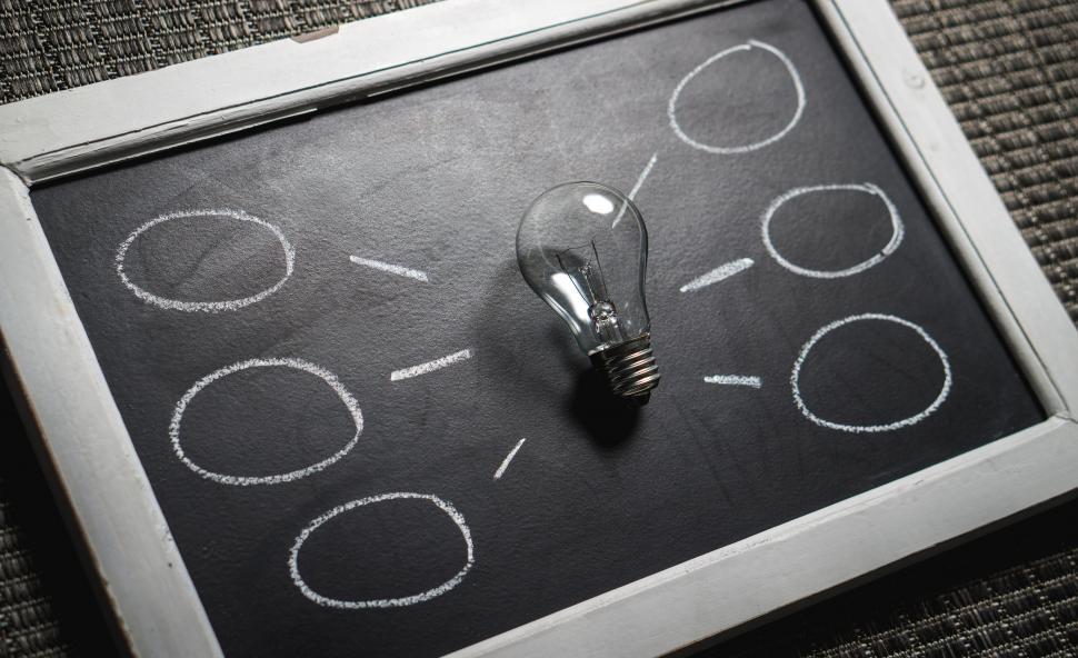 Free Image of A mind map created with chalk and light bulb 