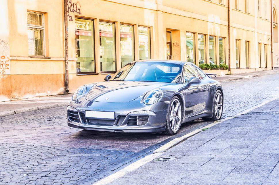 Free Image of Side view of a shining blue car 