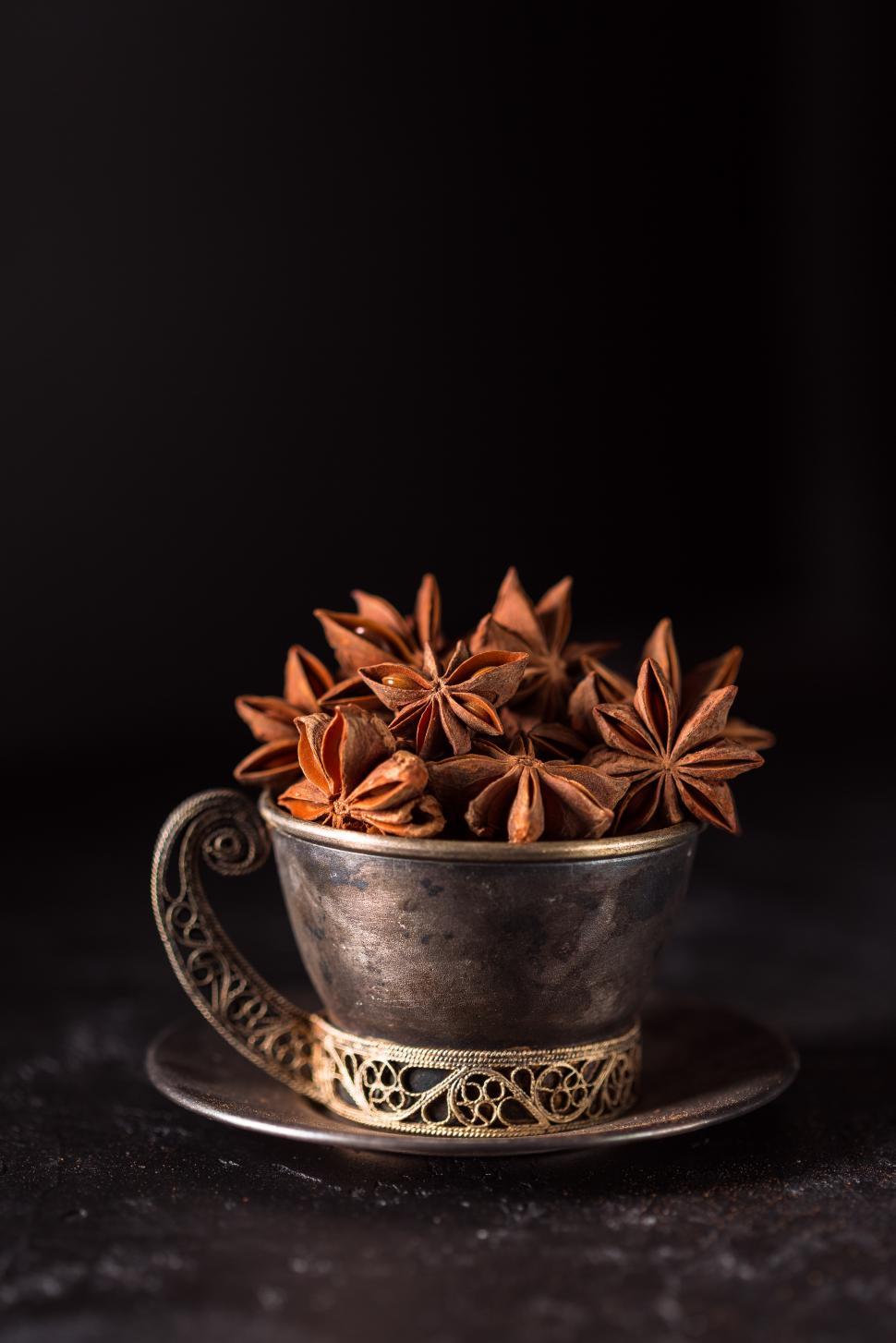 Free Image of Metal cup full of Star Anise 