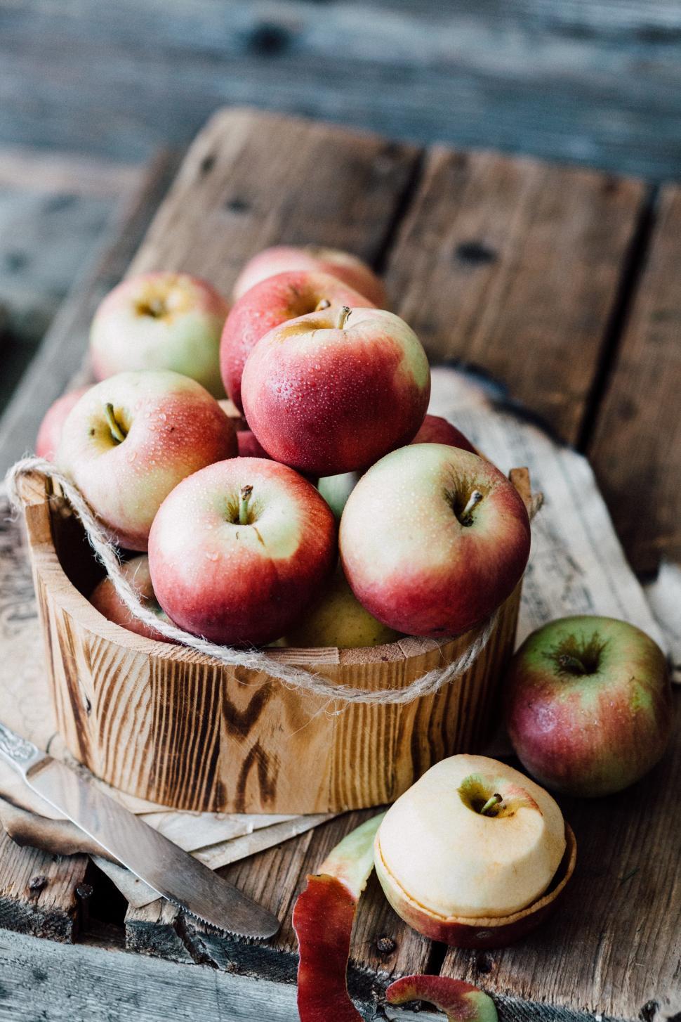 Free Image of Close-up of fresh red apples on wooden desk 