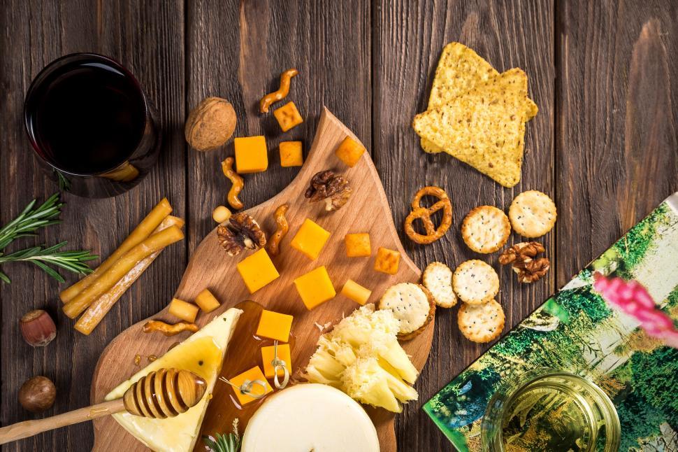 Free Image of Different types of cheese on wooden table 