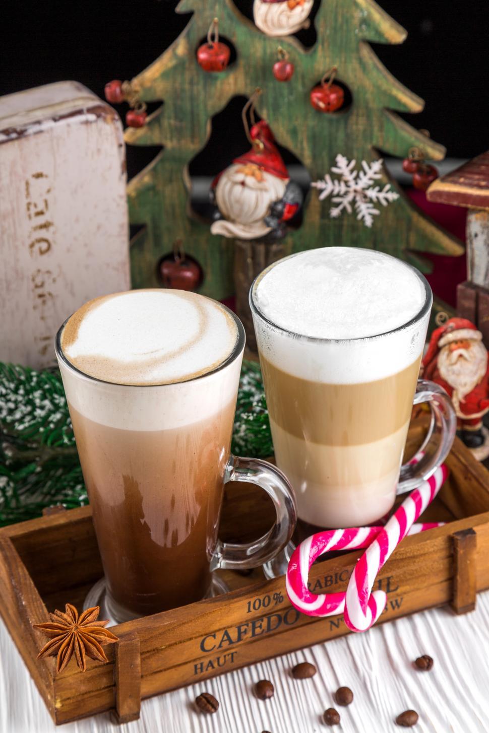 Free Image of Close up of frothy, layered cappuccino in a clear glass mugs 