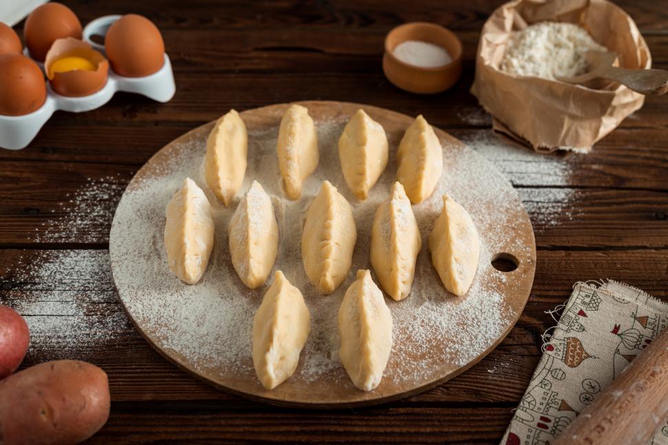 Free Image of Close up Russian pirozhki baked patties ready to be baked 