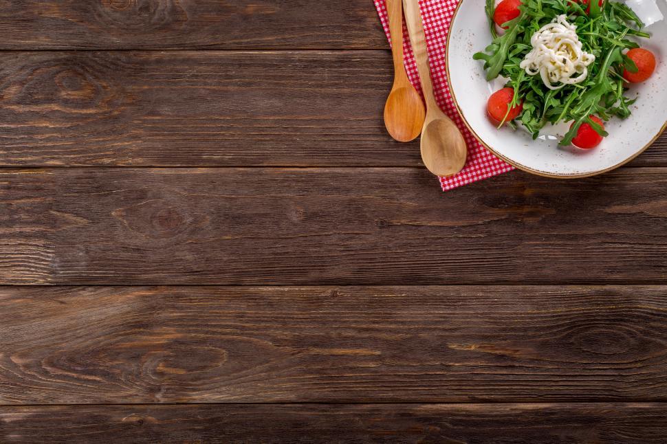Free Image of Overhead view of vegetable salad in a white ceramic plate 