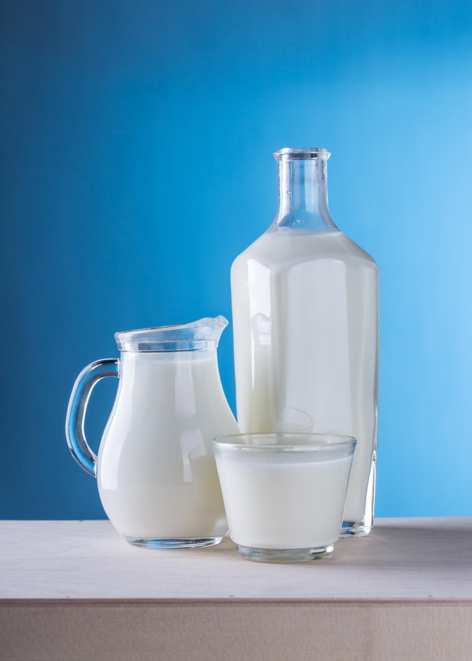 Free Image of Close up of a glass, a pitcher and a bottle 