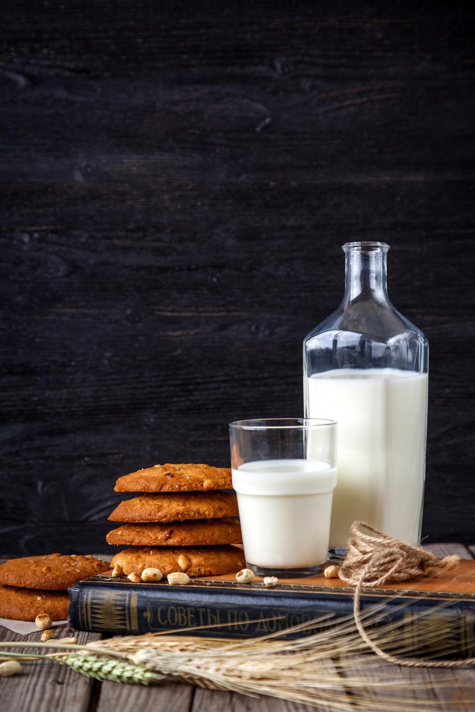 Free Image of Close up of glass, pitcher and bottle containing milk 