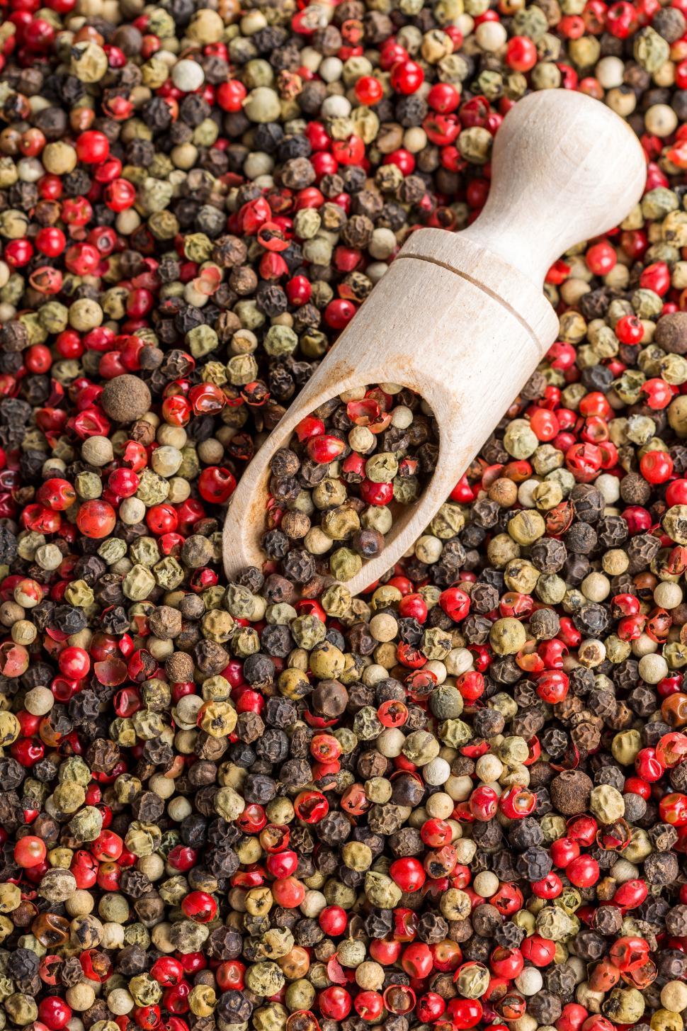 Free Image of Overhead view of dried pink peppercorn and black pepper 