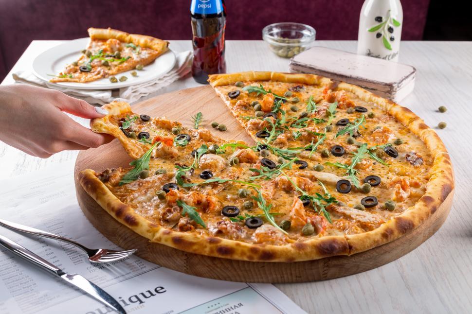 Free Image of Pizza and hand close up 