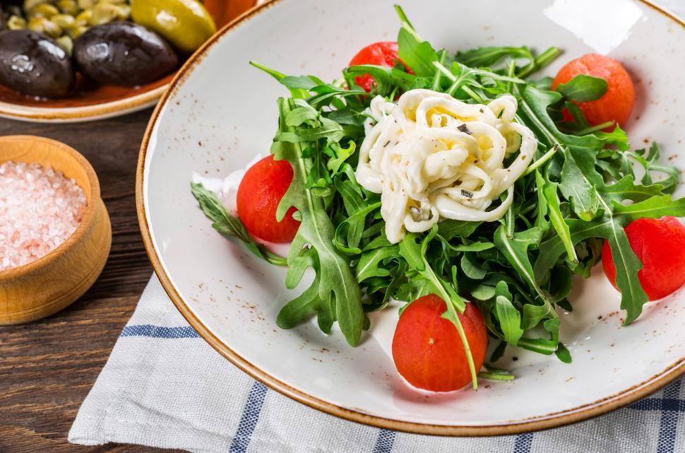 Free Image of Overhead view of vegetable salad in a white ceramic bowl 