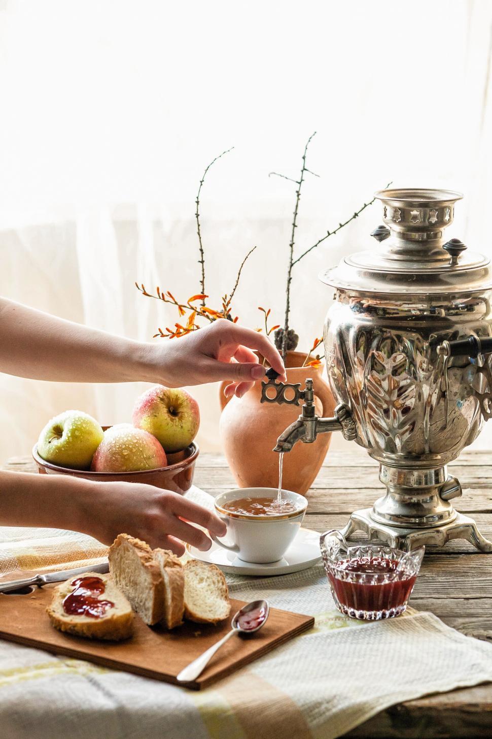 Free Image of Tea being poured into a cup from Russian Samovar 