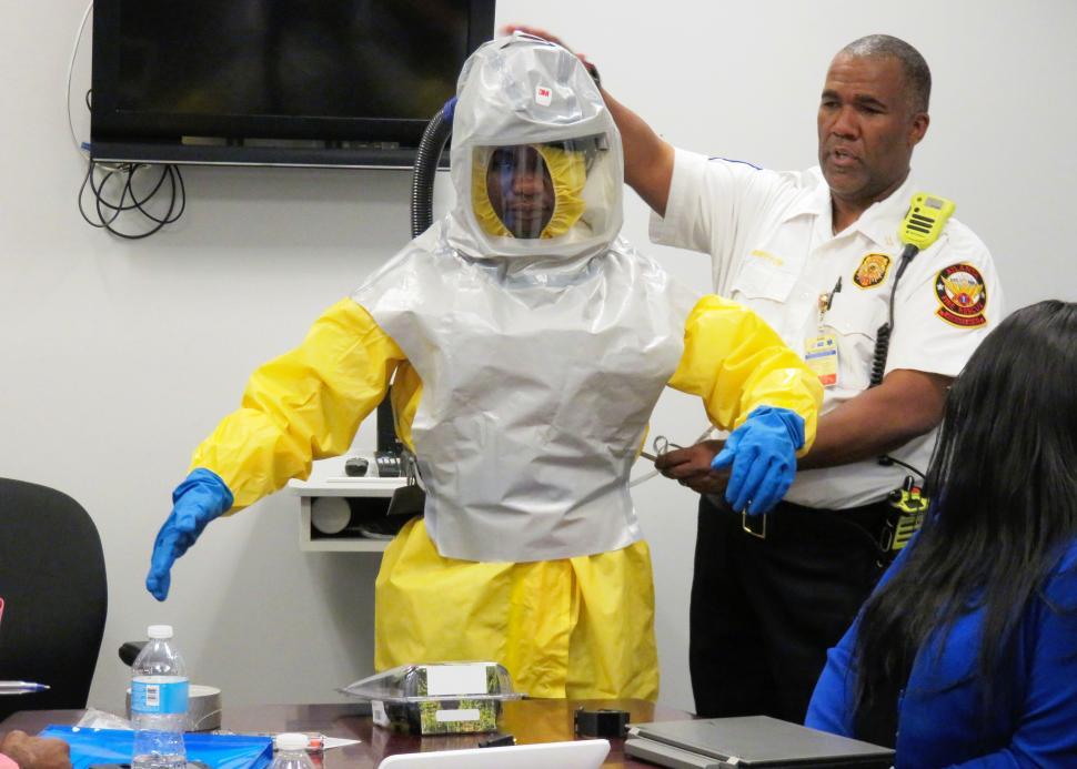 Free Image of Police and Person in Contamination Suit 