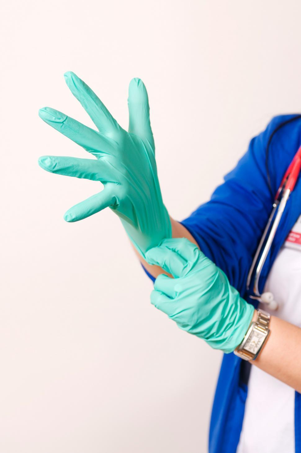 Free Image of Putting on Rubber Gloves 