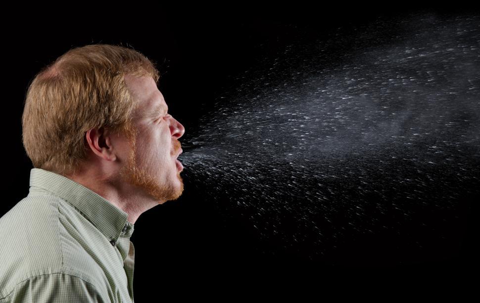 Free Image of Man Spreading Germs with a Sneeze 