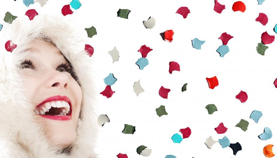 Free Image of Woman looking up over confetti background 