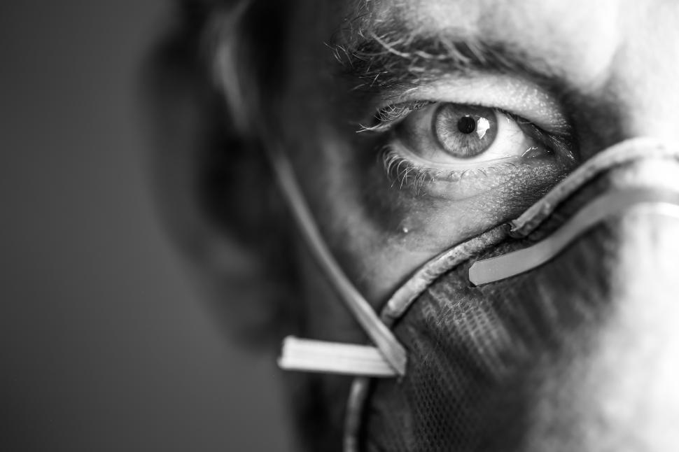 Free Image of Black and White Close up of Man Wearing Respirator Mask  