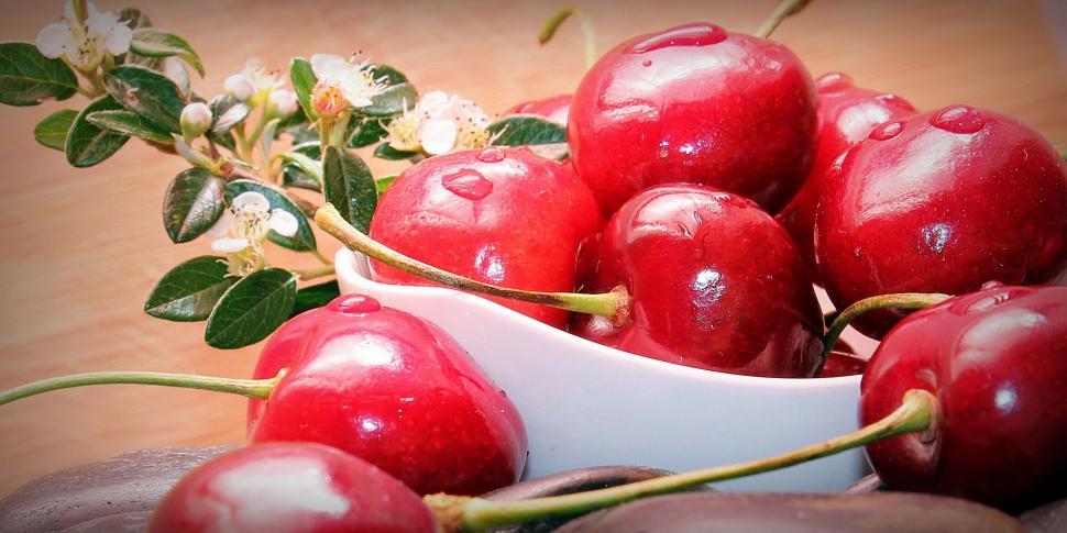Free Image of Bowl of Cherries and Blossoms 
