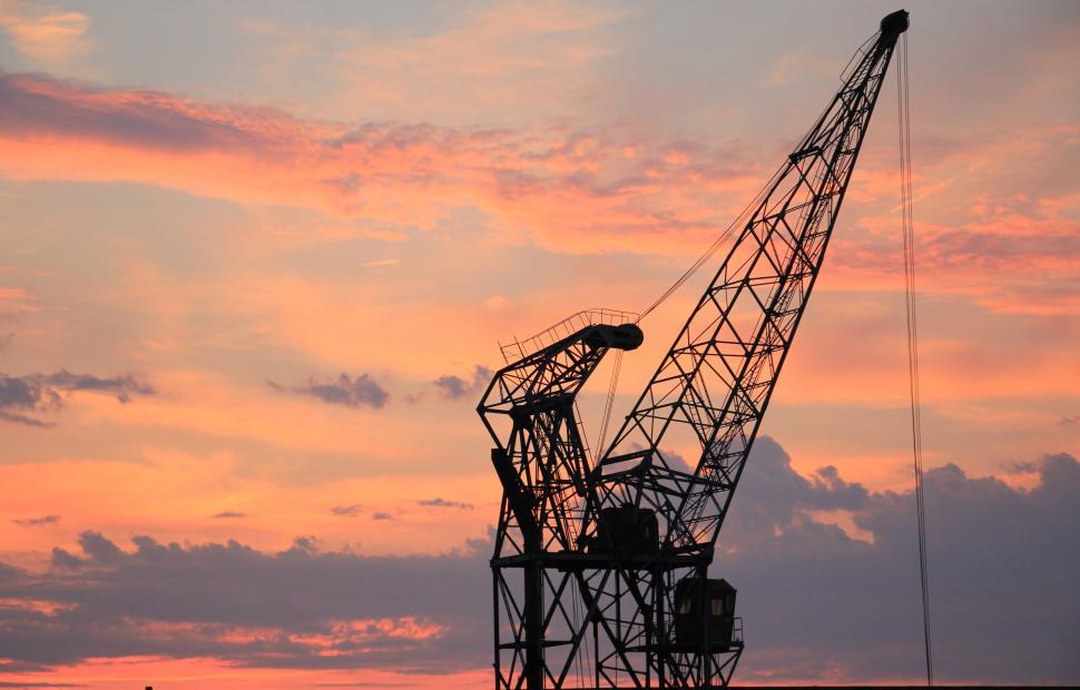 Free Image of Harbor Crane Against Sunset Sky 