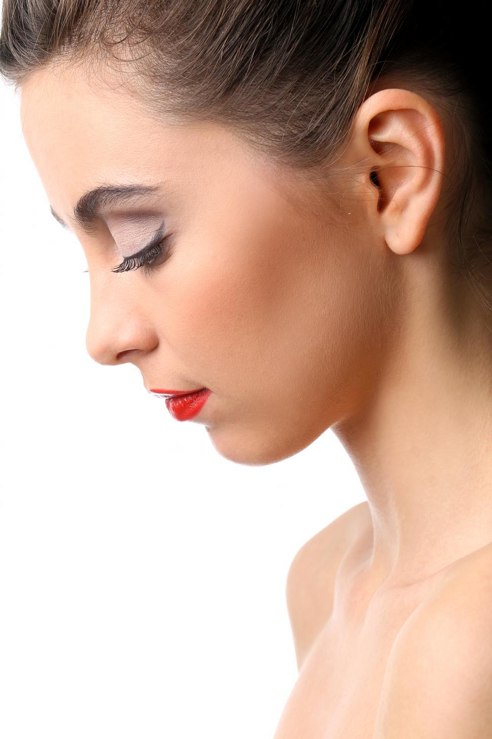 Free Image of Beautiful girl looking down, white background 