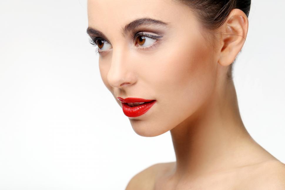 Free Image of Close view of beautiful girl with perfect skin and red lipstick 